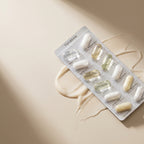 Blister pack of Yunassie supplements on a beige background