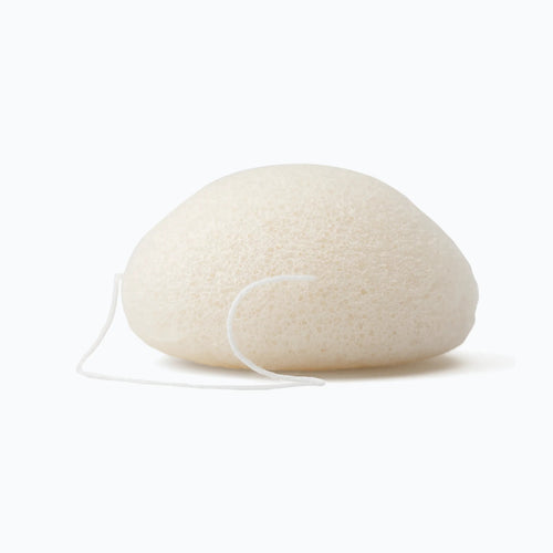 White stone-like object with a string on a white background