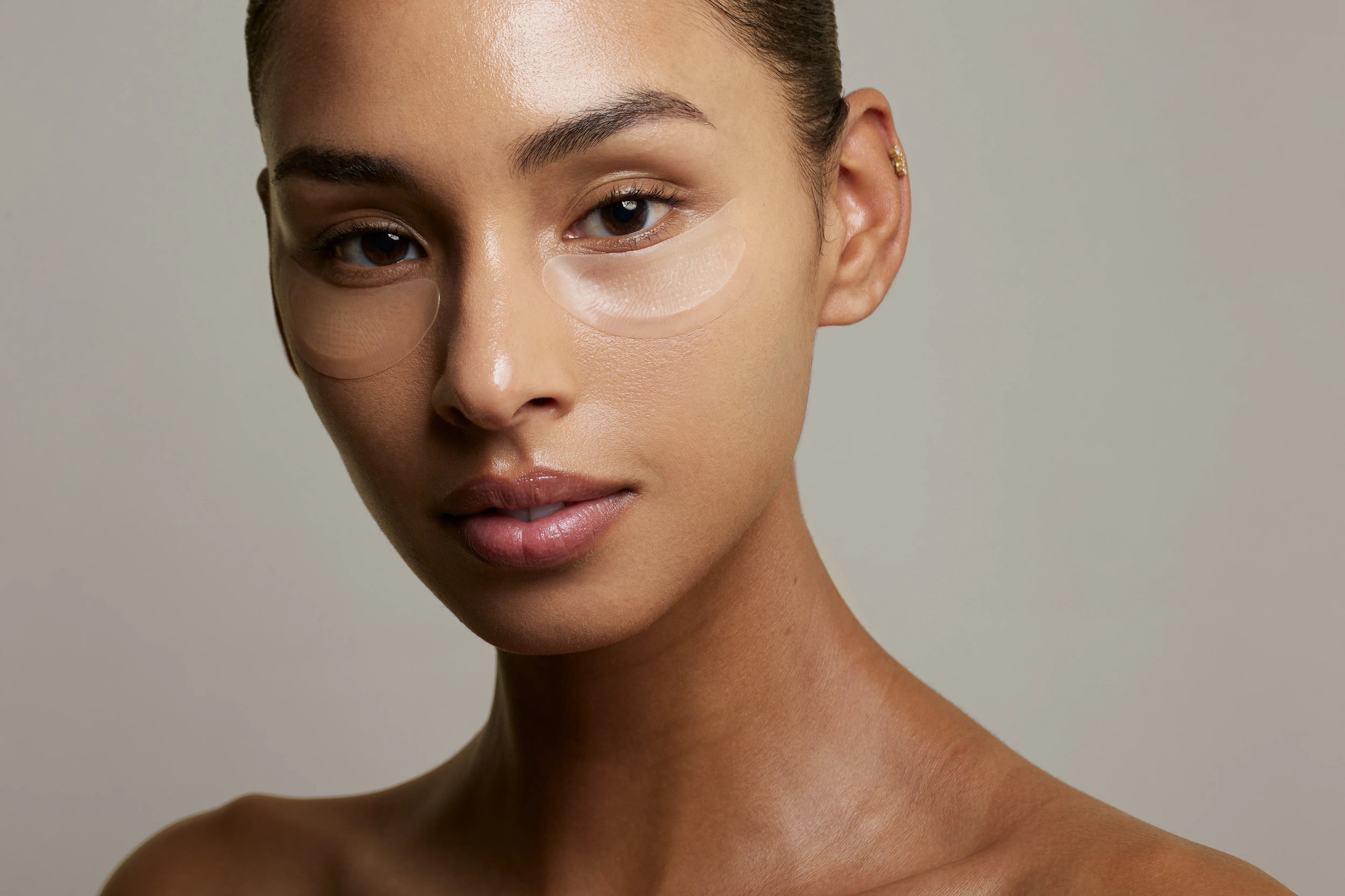 Close-up of a woman's face with a neutral background